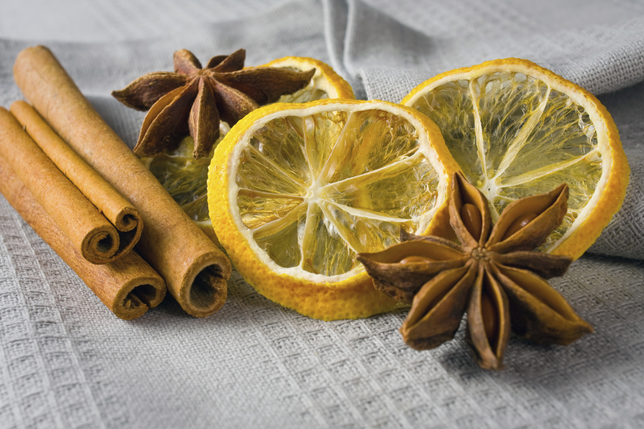 cinnamon sticks, anise stars and sliced of dried citrus