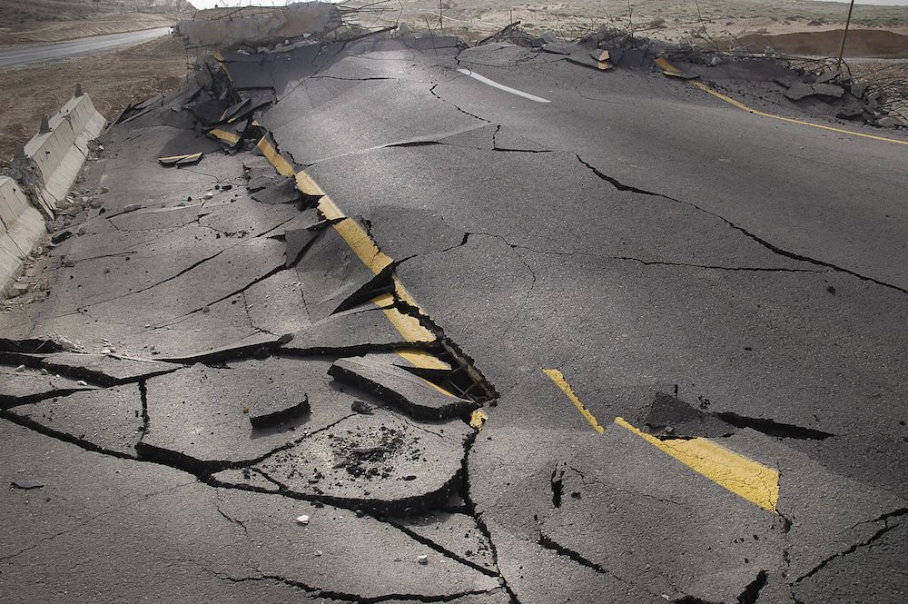 cracked asphalt after earthquake