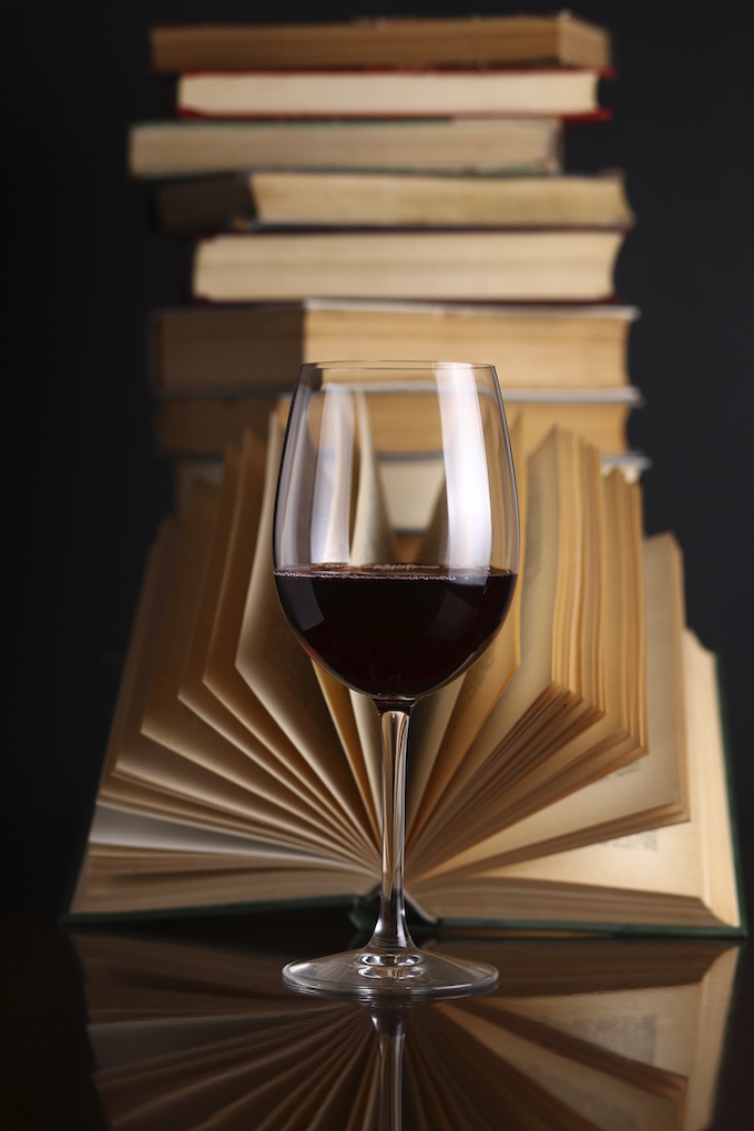 Wine glass and books