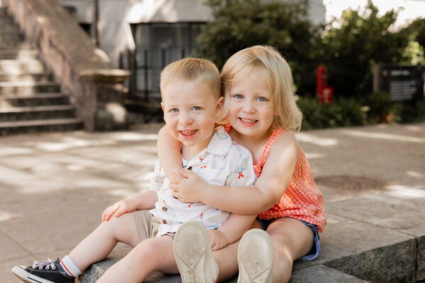 Siblings pose for Jeni Derrick at Denny Hall