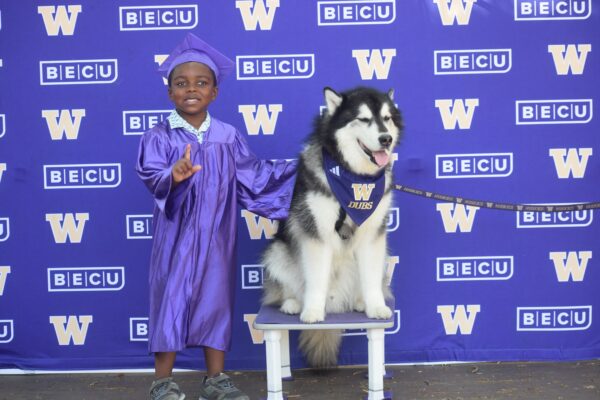 Dubs posing with young graduate