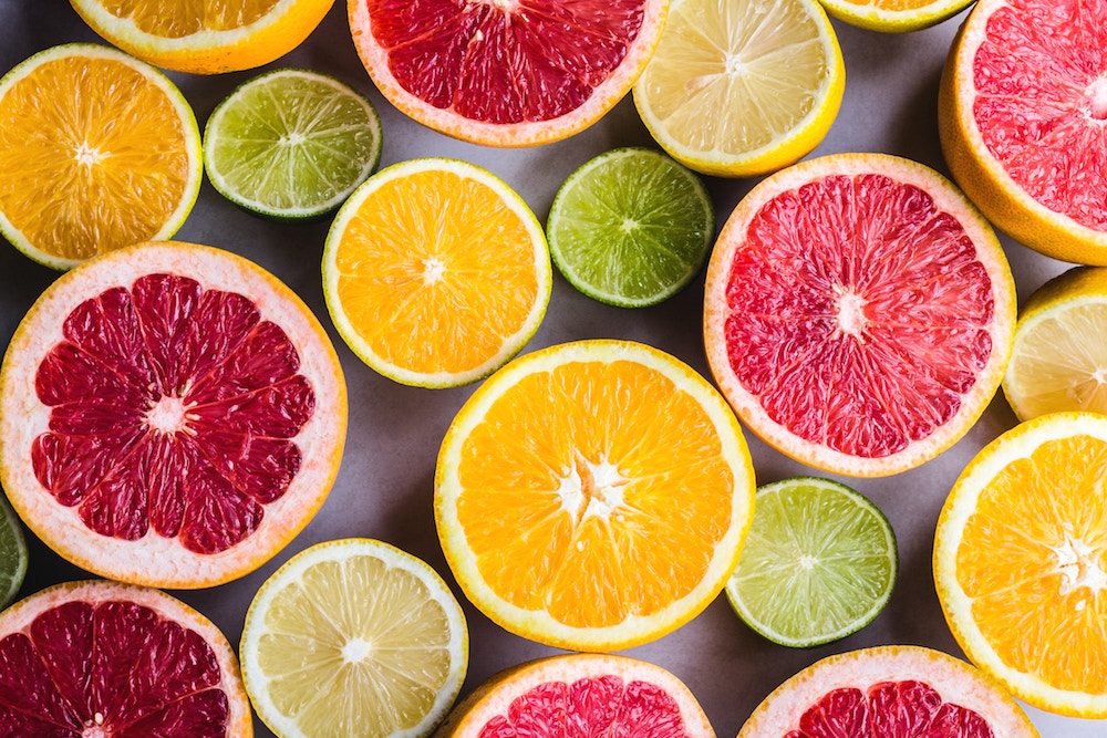 This image depicts different types of citrus fruit containing healthy Vitamin C