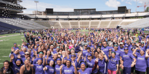 Hundreds of UW Fitness Day participants smile for the drone shot.