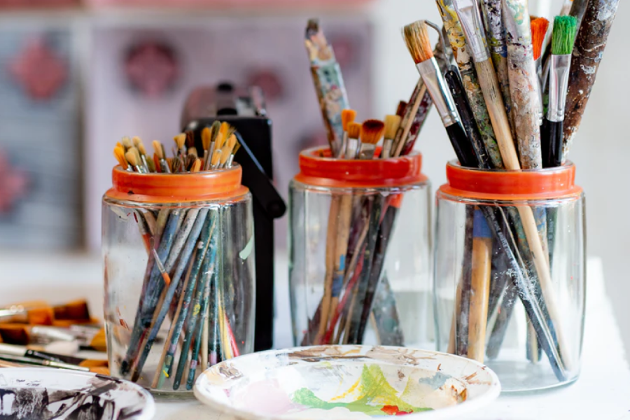 mixed painting supplies on a table