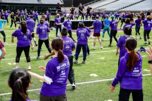 UW Fitness Day participants warm up with Samba dance moves.