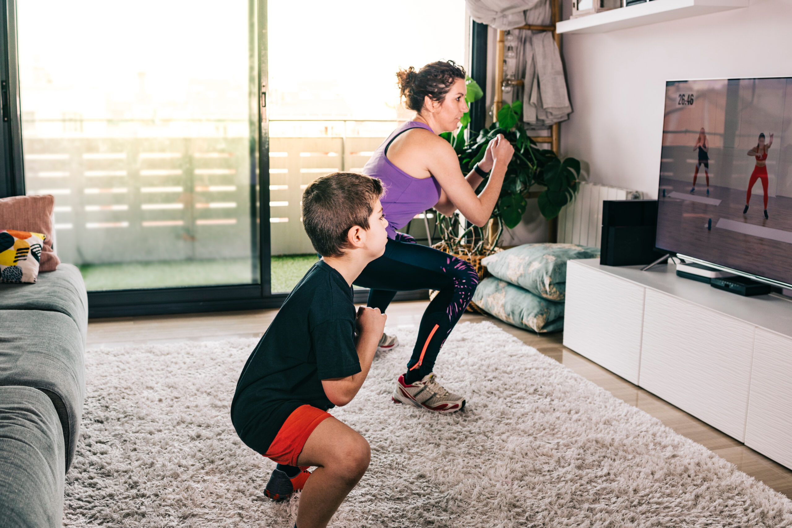 woman and child squatting in living room