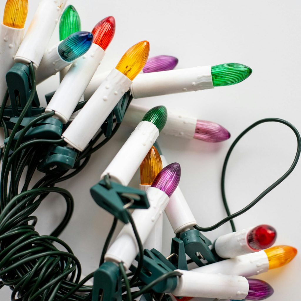 christmas lights laid on a white background