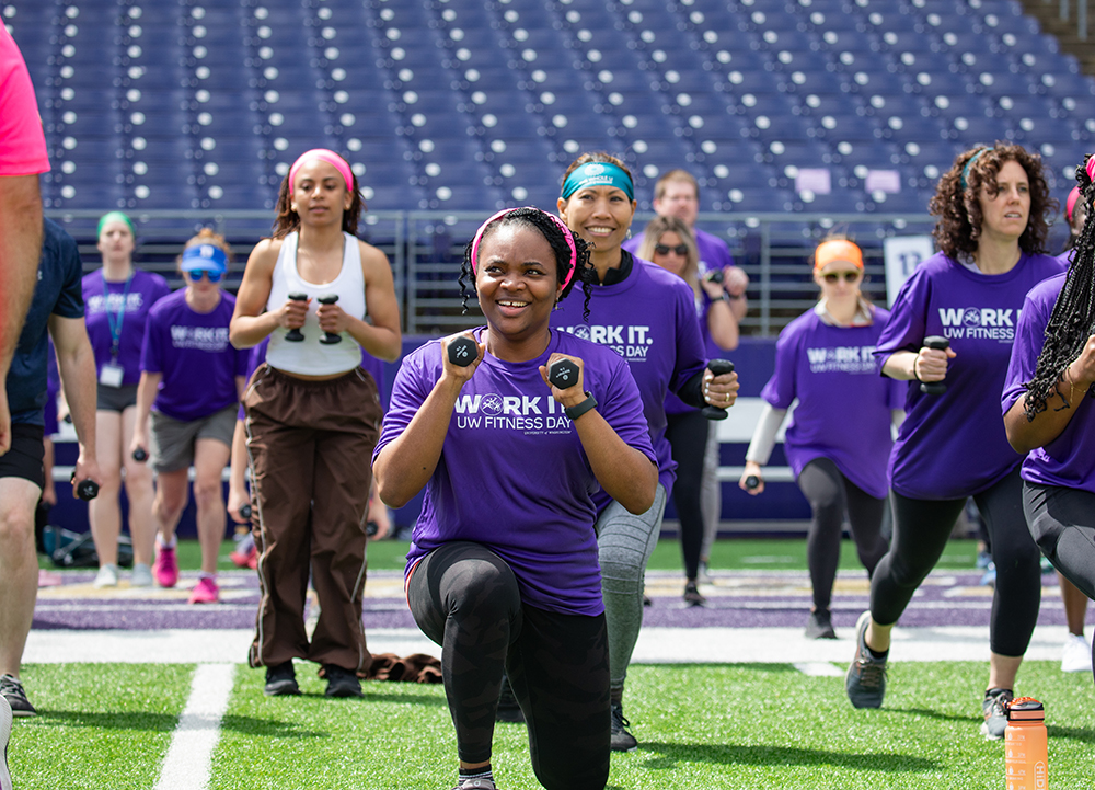 Fitness Day participants smiling and using weights