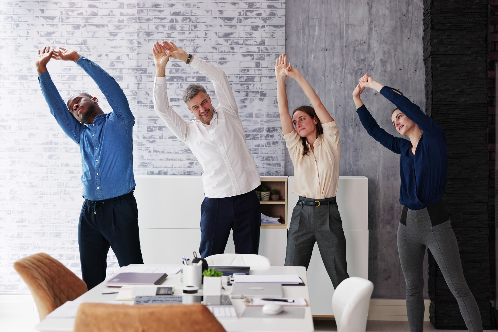 a working group stretching together in office